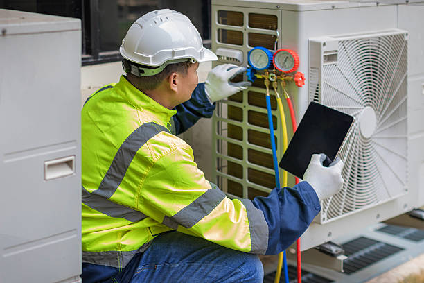 Professional Air Conditioning Repair technician working in Schwenksville, PA